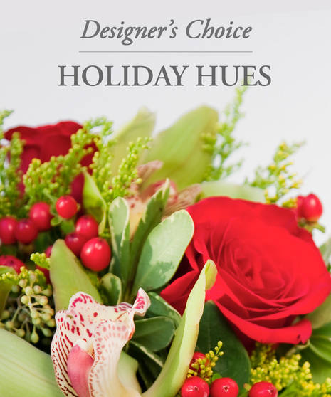 example of Christmas bouquet with orchids, roses, hypericum berries, and more